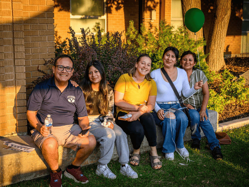 Group of community members gathered outside a Utah community resource center, representing local programs, connection, and neighborhood engagement
