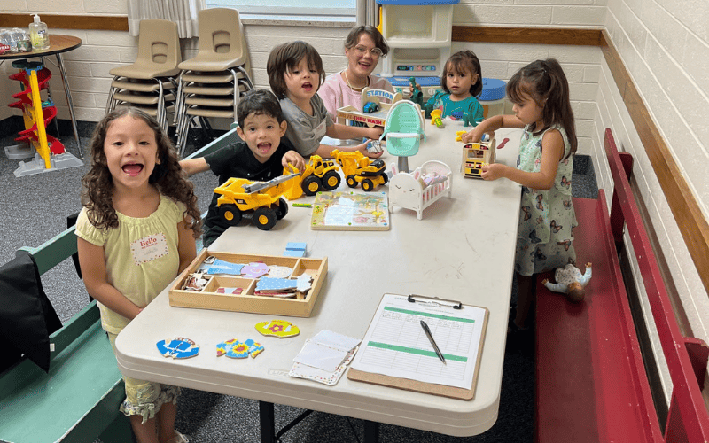 Children engaged in play-based learning, representing early development, exploration, and social connection