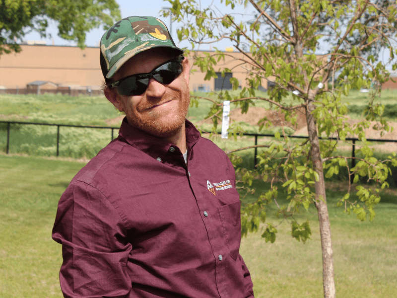 Community member supporting urban greening efforts through tree planting and environmental care